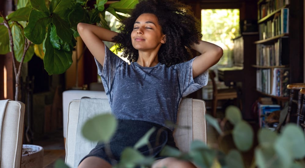 A resident relaxes in her apartment at Brentwood Apartments in Painesville, Ohio