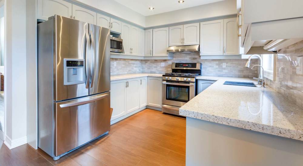 Kitchen with stainless-steel appliances at Newport Avenue Apartments in Rumford, Rhode Island