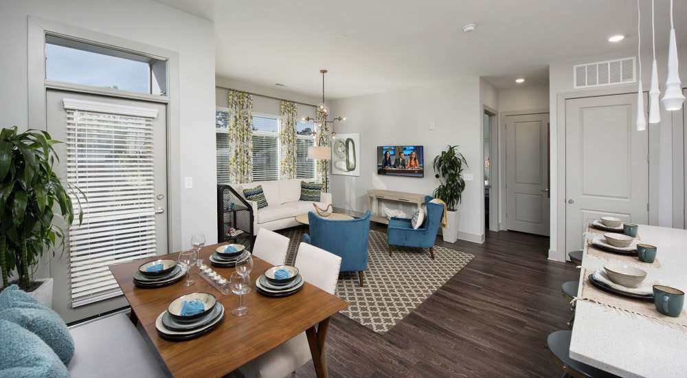 Spacious apartment with a visible dining space and living area at Siena Suwanee Town Center in Suwanee, Georgia