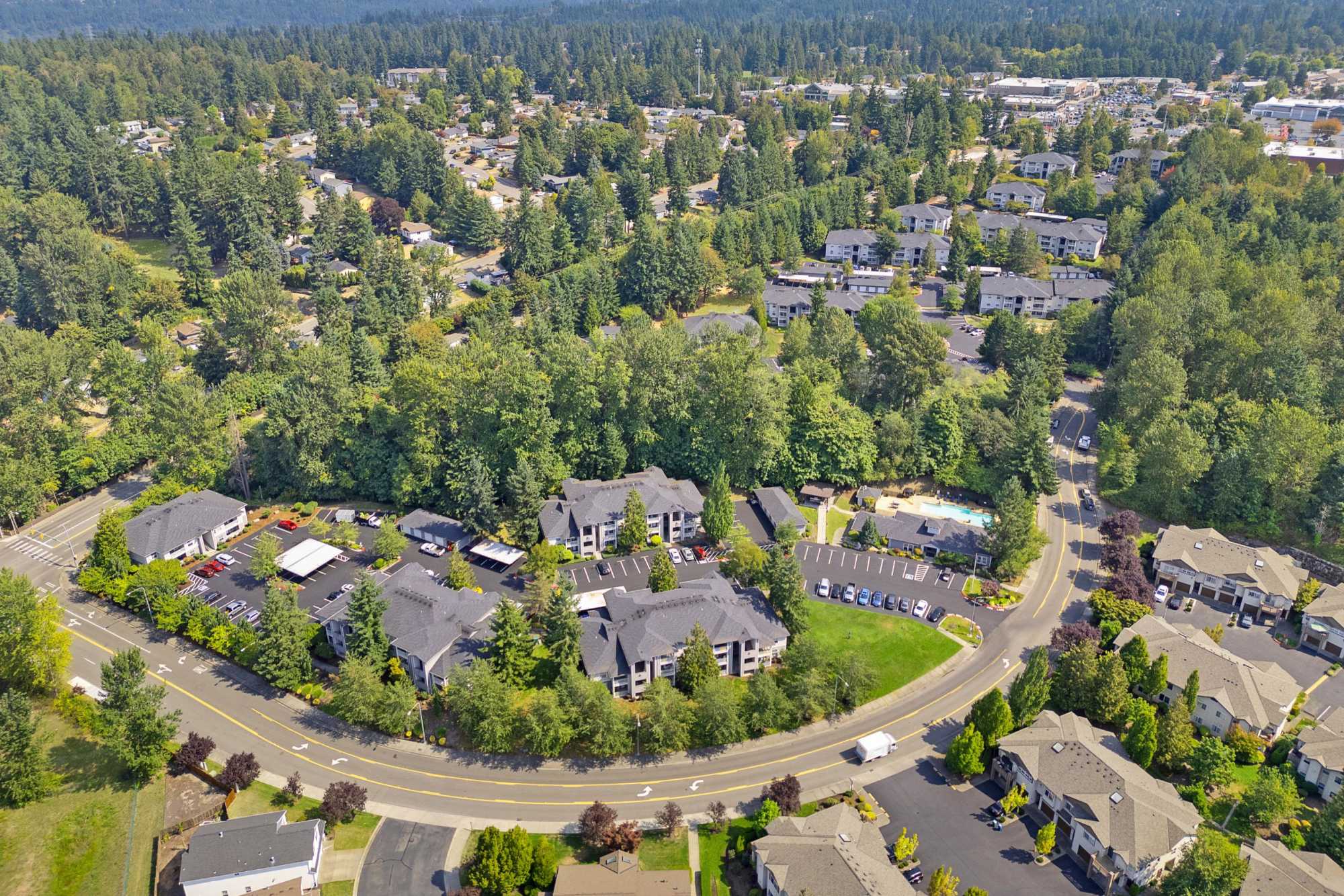Aerial view of the property and surrounding area at Pebble Cove Apartments in Renton, Washington