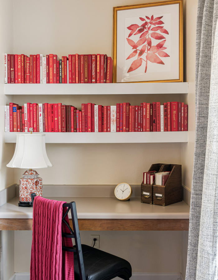 Desk with a bookshelf in a student apartment at River Pointe in Carrollton, Georgia