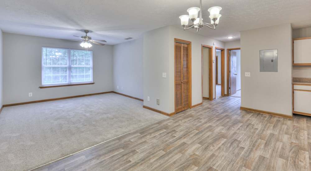 Unfurnished apartment living room with wood-style flooring at Laurel Wood Apartments in Smyrna, Tennessee