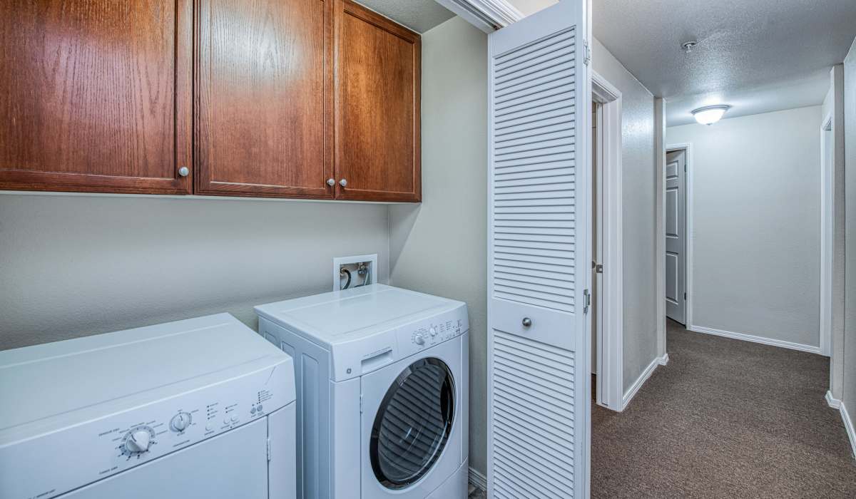 A washer and dryer in the laundry area at Westwood Bluffs in Fresno, California