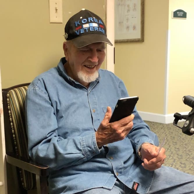 Resident facetiming family at Grand Villa of Altamonte Springs in Altamonte Springs, Florida