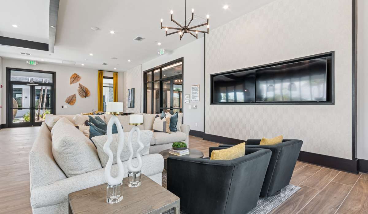 Seating area in the community lounge at Savelle Nona West in Orlando, Florida