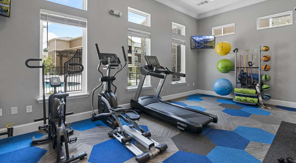 Fitness center with treadmills at Stonebridge Apartment Homes in Lufkin, Texas
