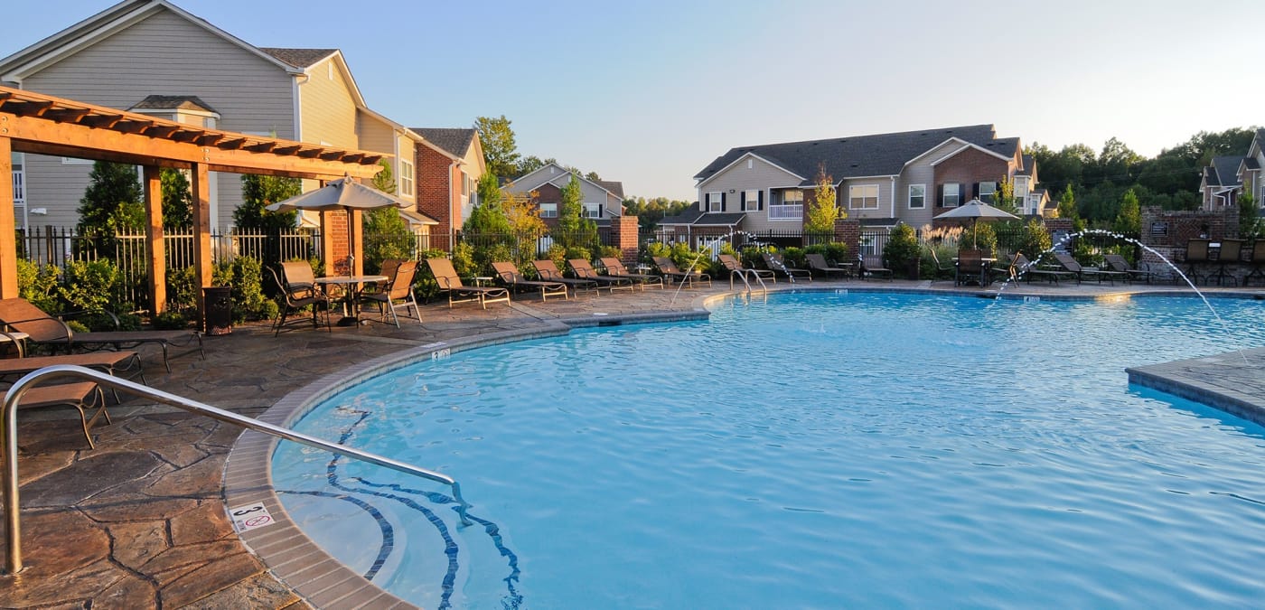 Evening time view of swimming pool at Villas at Houston Levee East Apartments in Cordova, TN