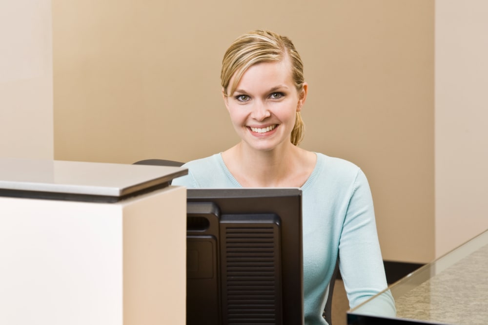 A women at the front desk at I-205 Mini Storage in Vancouver, Washington