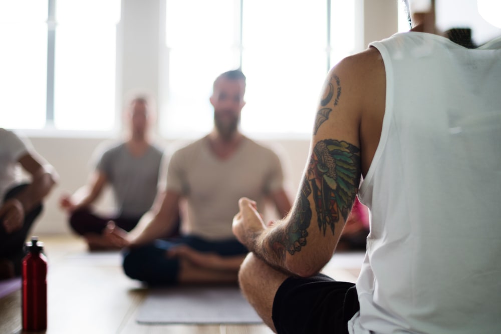 Residents doing yoga at Promenade at Hunter's Glen Apartments in Thornton, Colorado