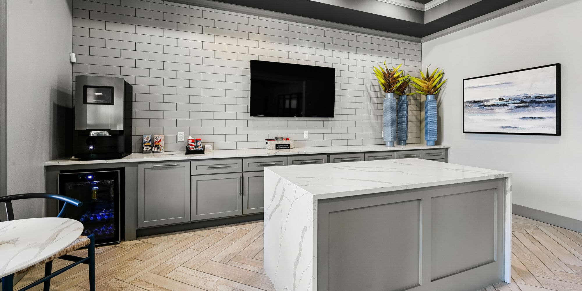 Community area with wall-mounted TV at Seacrest in Katy, Texas