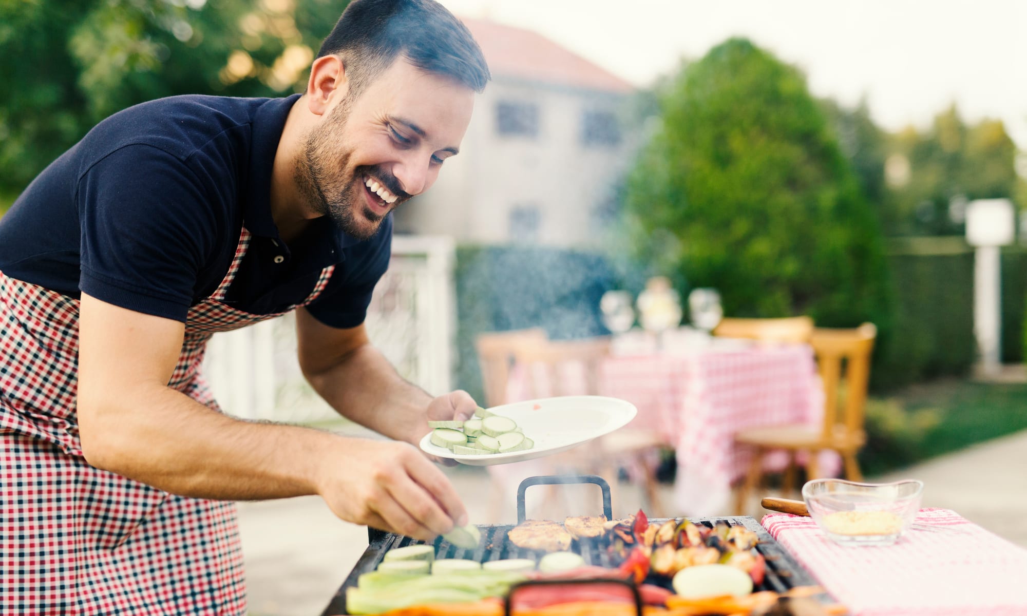 Resident cooking at his apartment home at Avilla Gateway in Phoenix, Arizona.