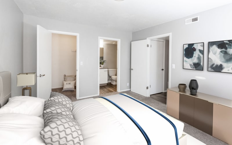 Spacious master bedroom with plush carpeting at Windgate Apartments in Bountiful, Utah