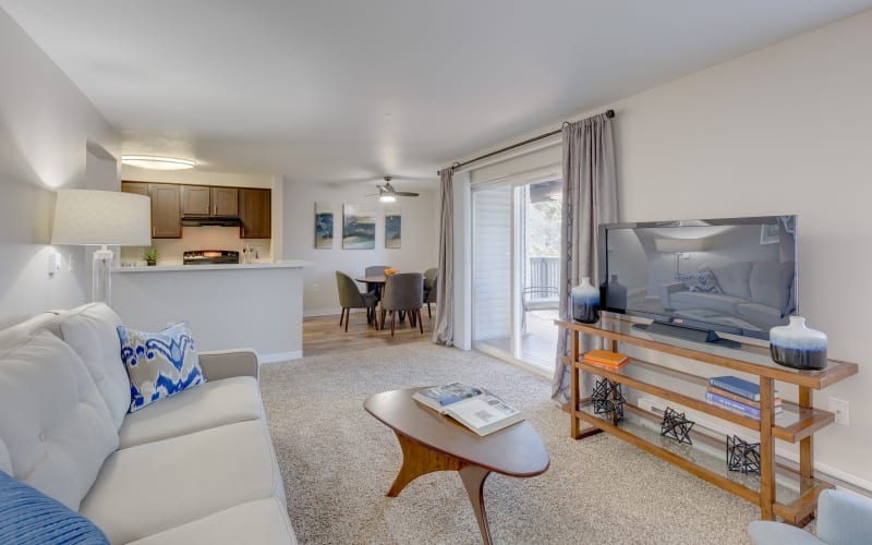 Bright living room with private patio access at Cascade Ridge in Silverdale, Washington