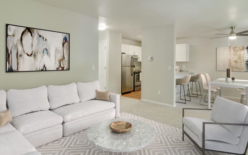 Bright and spacious living room, dining room and kitchen at Carriage House Apartments in Vancouver, Washington