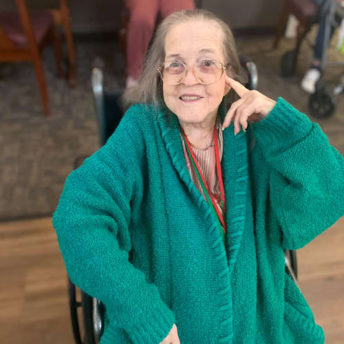 Resident in a big teal coat at Canoe Brook Assisted Living in Broken Arrow, Oklahoma
