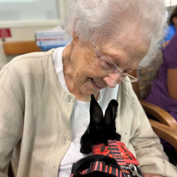 Resident with a bunny at The Columbia Presbyterian Community in Lexington, South Carolina