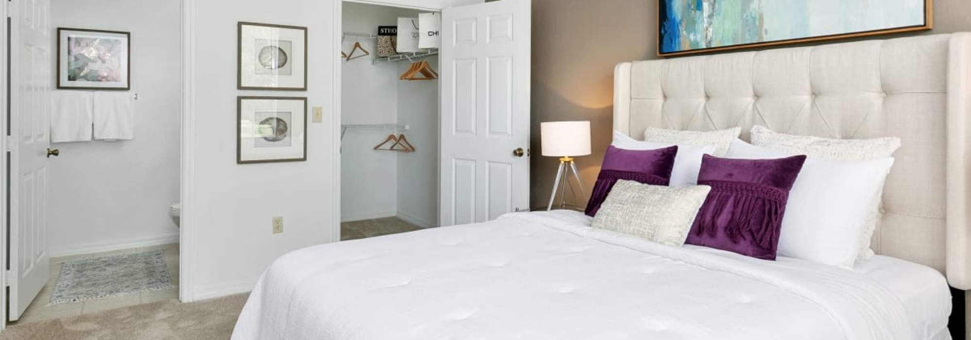 Bedroom with a walk-in closet at Woodmere Apartments of Venice in Venice, Florida