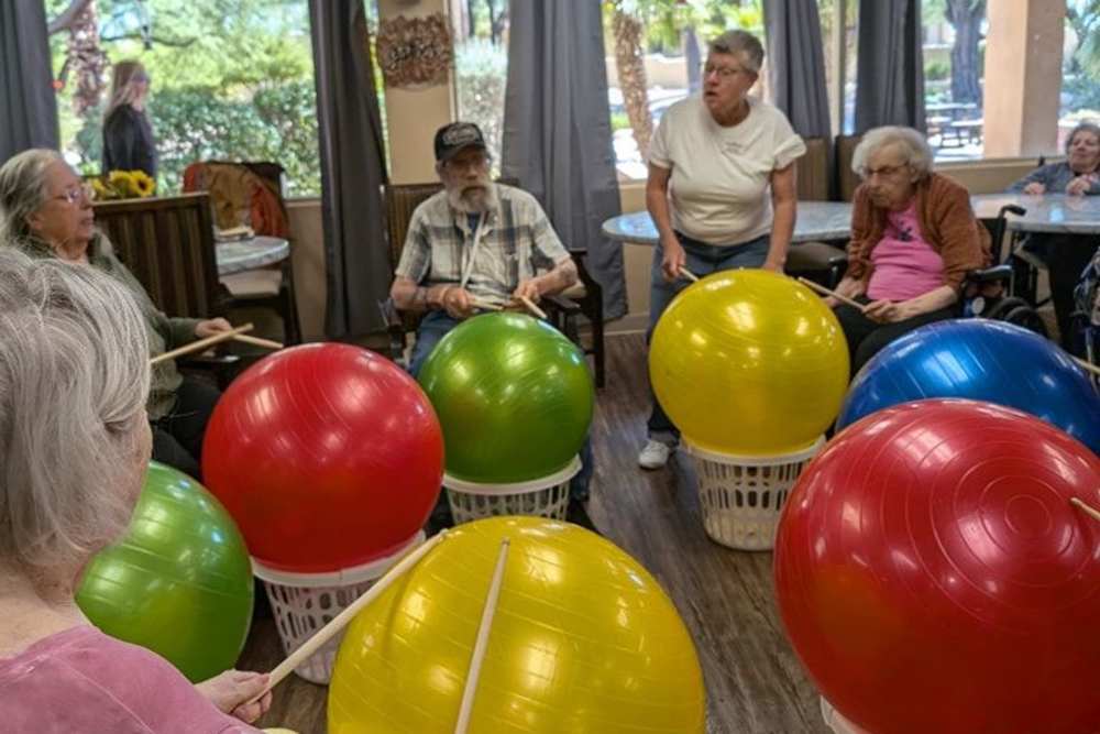 Residents doing a ball activity at Woodland Palms Memory Care in Tucson, Arizona