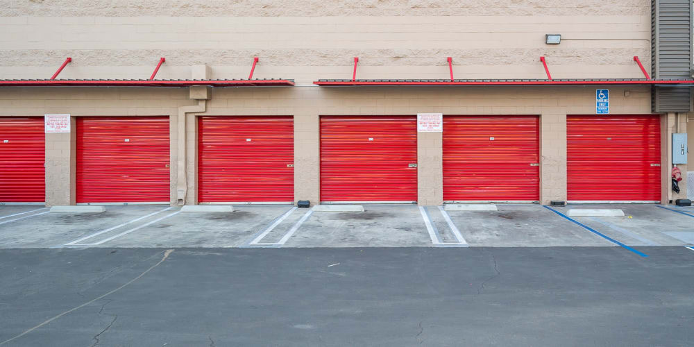 Exterior storage units with red doors at StorQuest Self Storage in Los Angeles, California