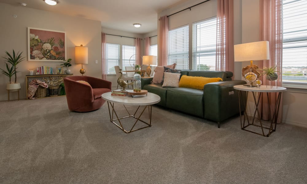 Spacious living room with plush carpeting at Redbud Ranch Apartments in Broken Arrow, Oklahoma