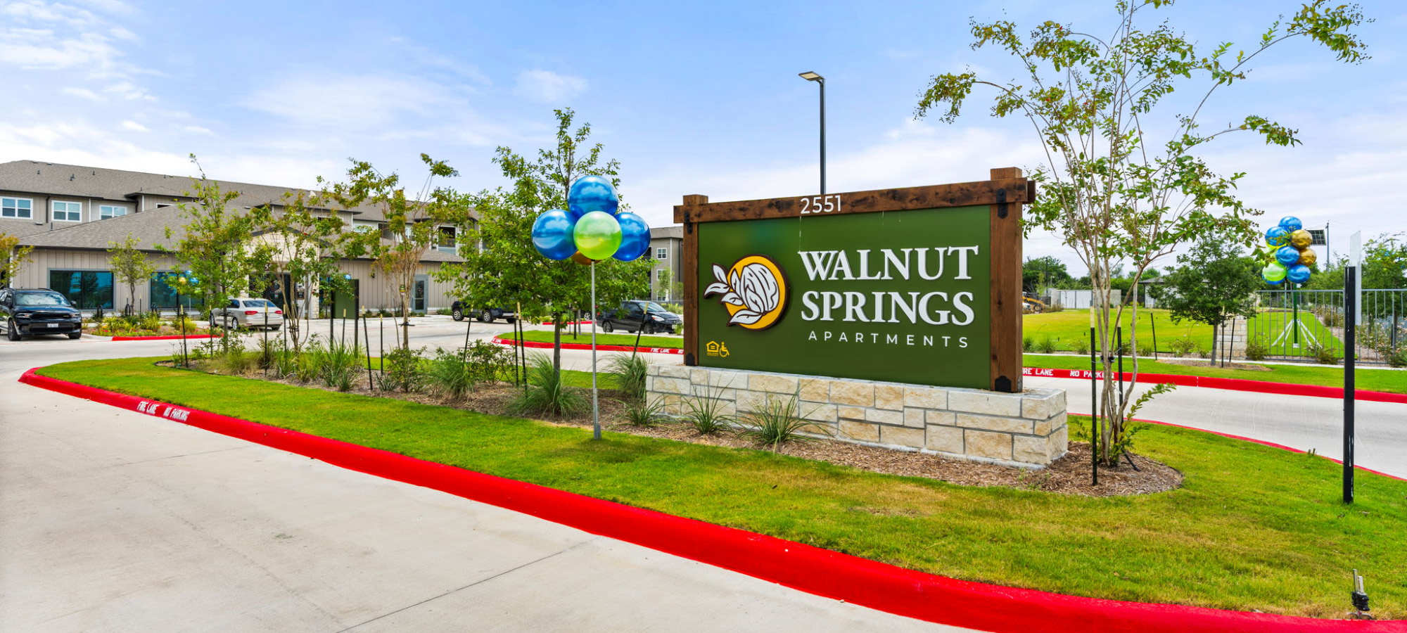 Community entrance with monument sign at Walnut Springs in Seguin, Texas