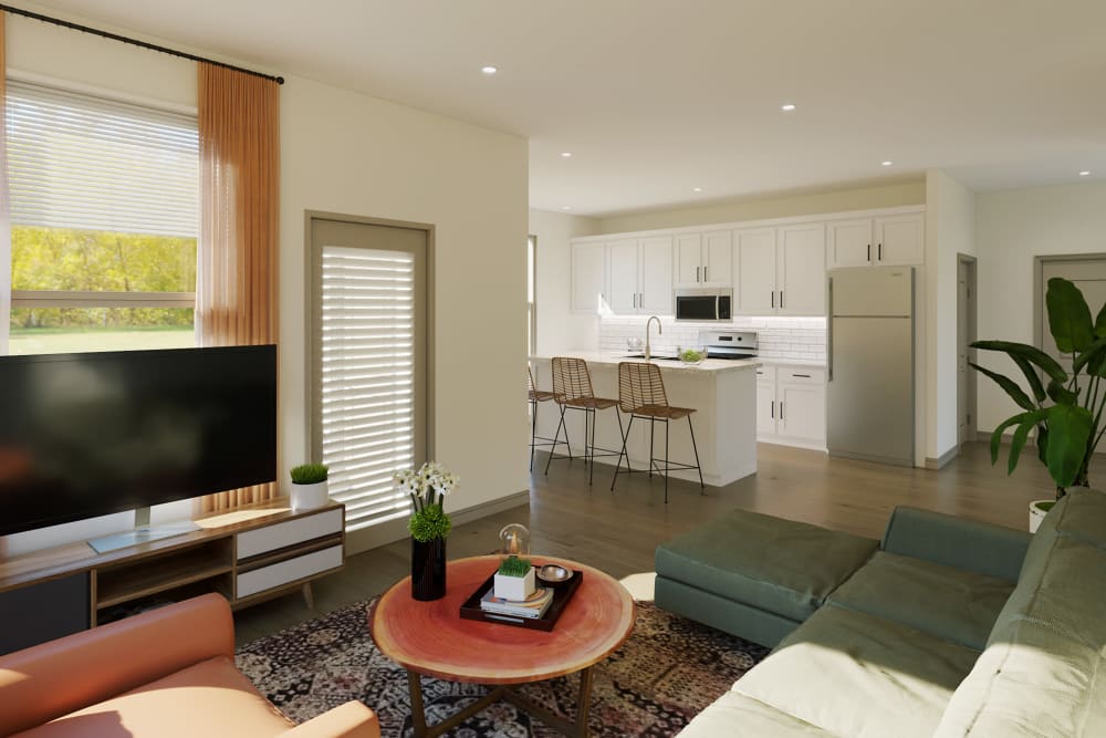 Open living room and kitchen layout in an apartment at The Waters at Millerville in Baton Rouge, Louisiana