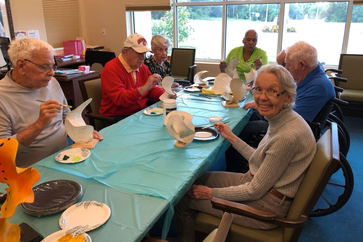 Residents making an art project at CERTUS Premier Memory Care Living in Orlando, Florida.
