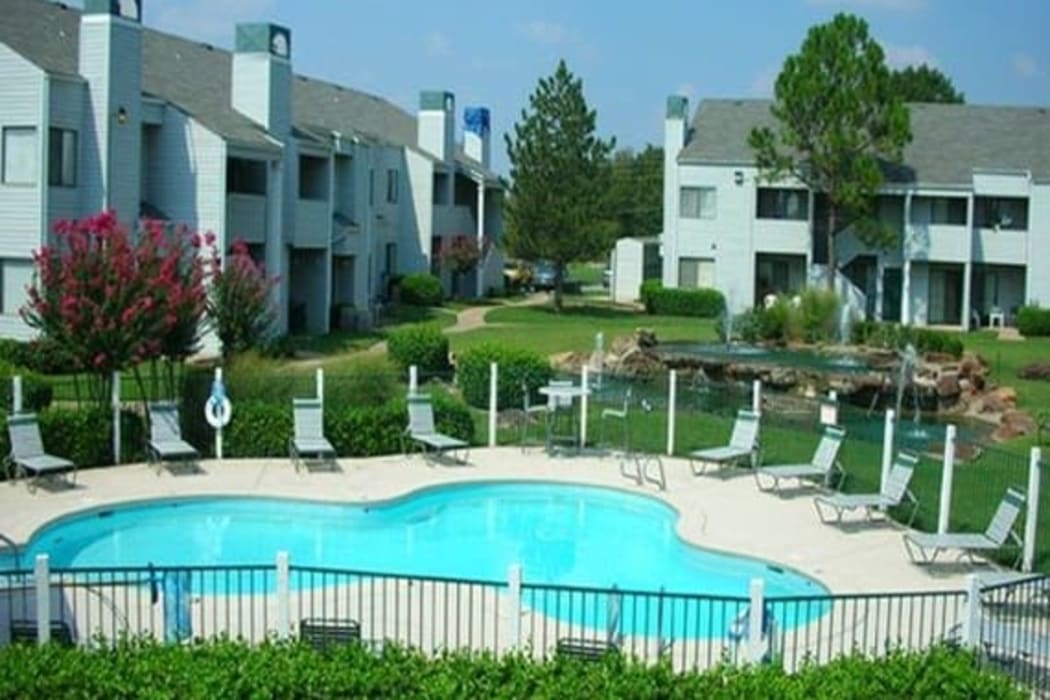 A fenced in community pool at Boulder Ridge in Tulsa, Oklahoma