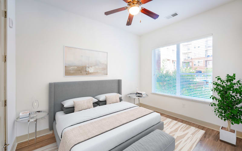 Spacious bedroom with plush carpeting at Helios in Englewood, Colorado