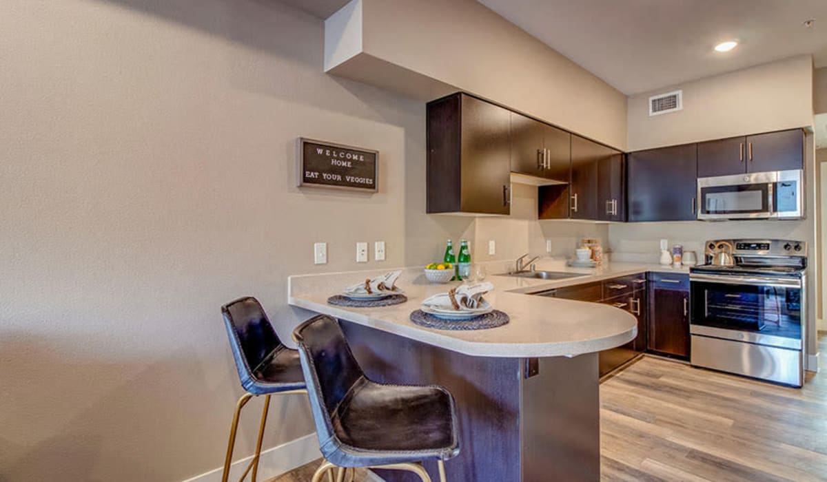 Kitchen and dining island at Riverside Park Apartments in Reno, Nevada Riverside Park Apartments in Reno, Nevada