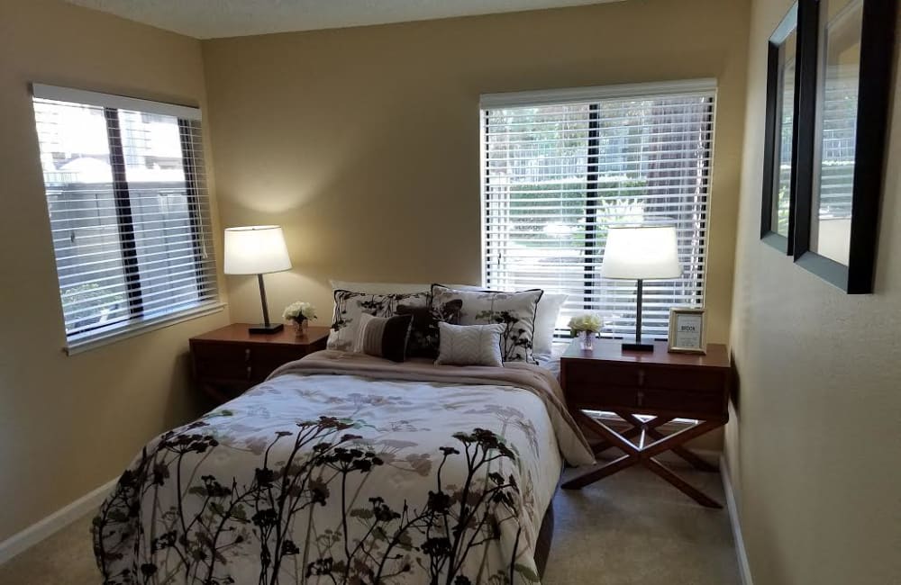 Bedroom with lots of windows at Muirwood Gardens in Martinez, California