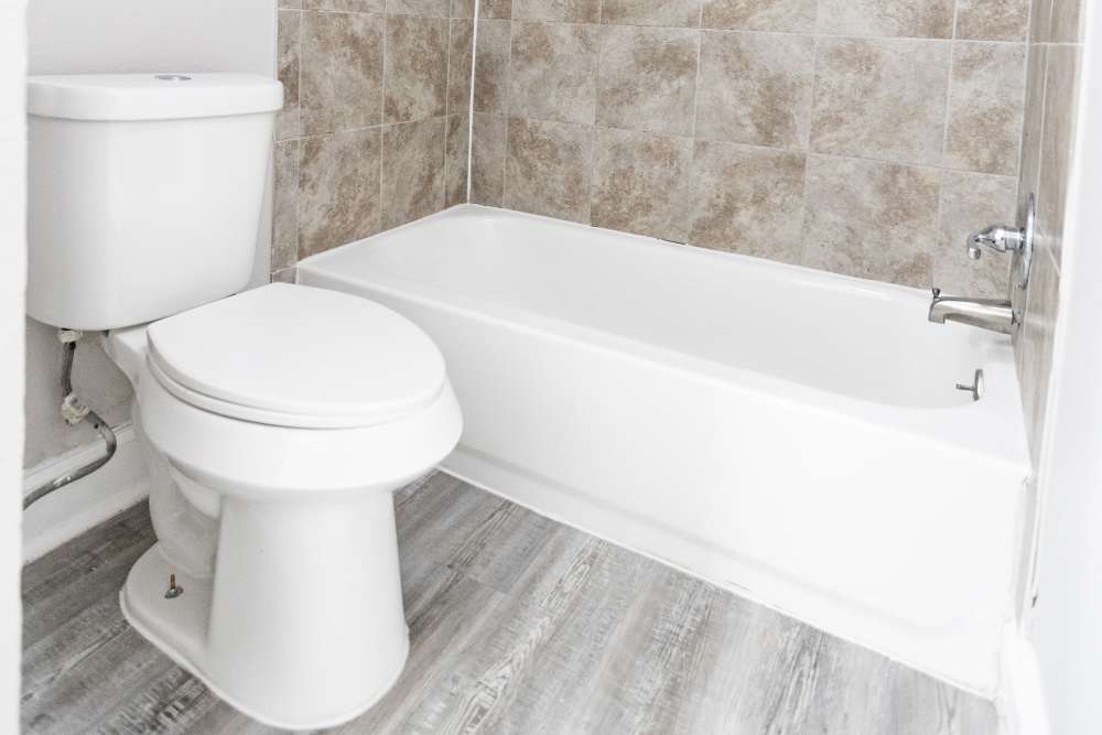 Modern bathroom oasis featuring sleek fixtures and a pristine bathtub at San Mateo Forest in Dallas, Texas.
