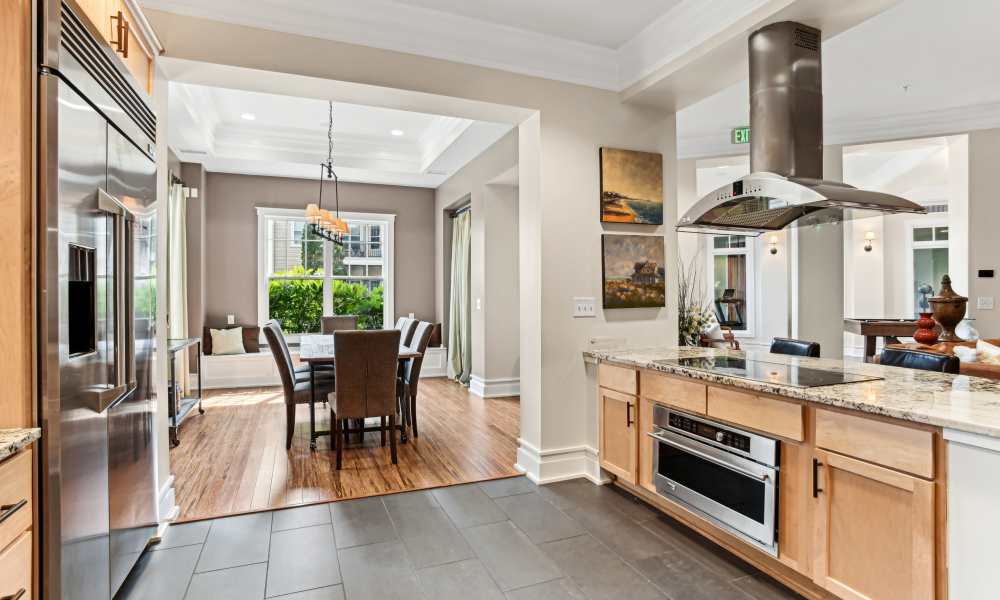 Subway tile backsplash and modern appliances in a clubhouse at Fountains at Mooresville Town Square in Mooresville, North Carolina 