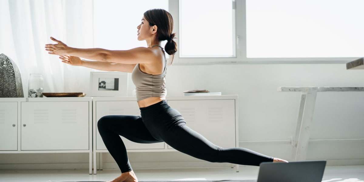 Resident doing yoga at Marquis at The RIM in San Antonio, Texas