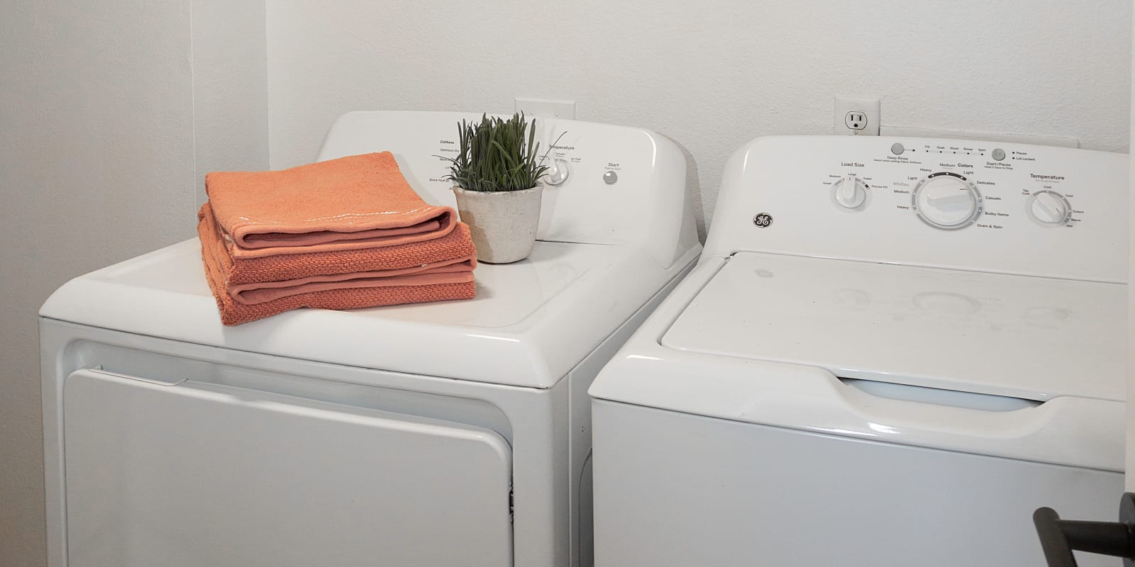 Washer and dryer in unit at Springs of Country Woods Apartments in Midvale, Utah