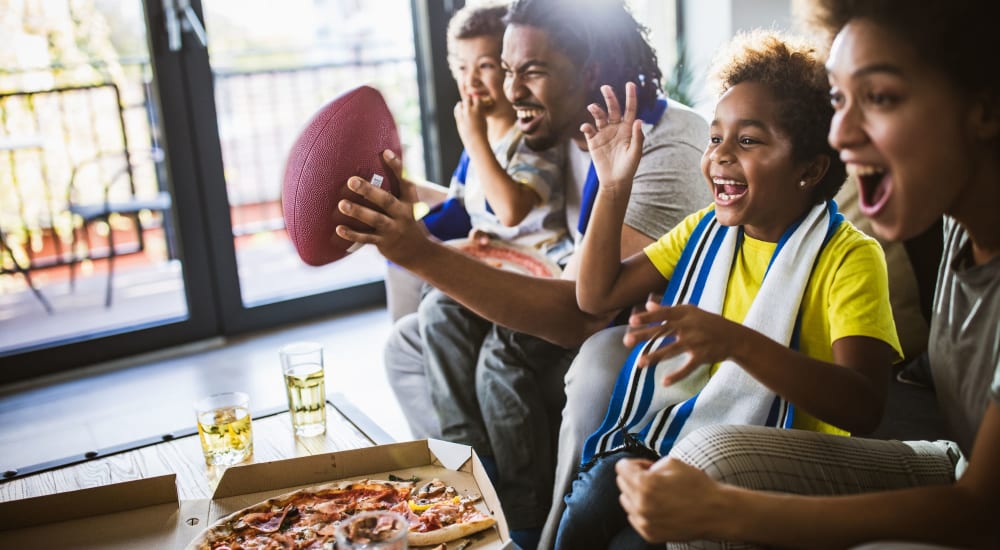 A family watches the game and eats pizza at Walton Crossings in Jeannette, Pennsylvania