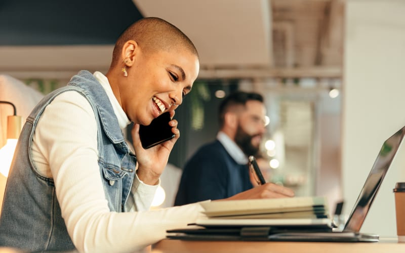 Woman taking a call in the coworking space at Kenect
