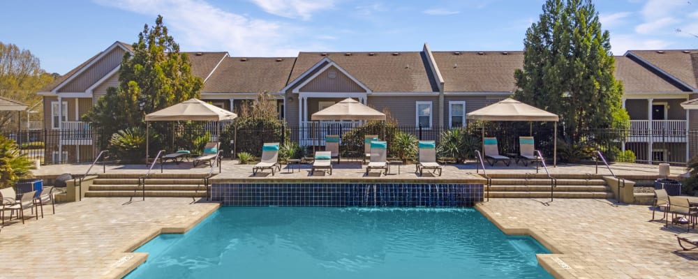 A sparkling community swimming pool at Adrian On Riverside in Macon, Georgia