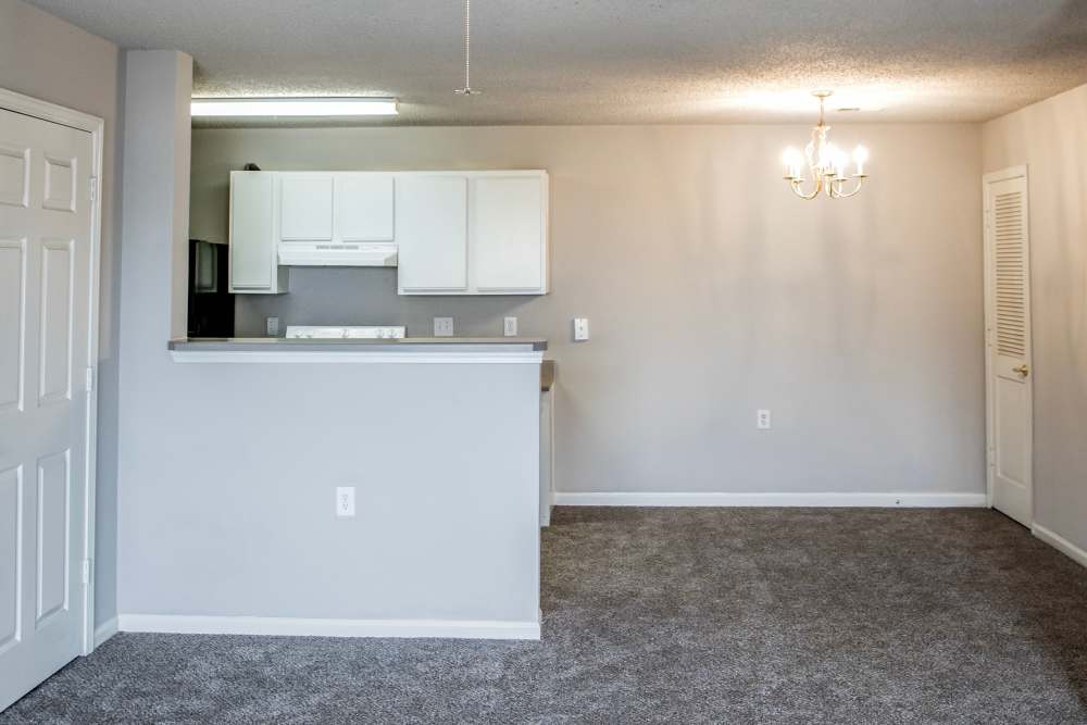 Living area with connecting kitchen at Whispering Plains Apartments in Guymon, Oklahoma