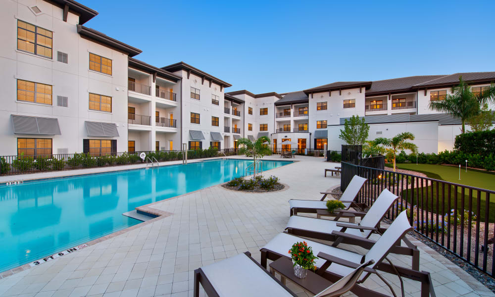 Outdoor pool area at at Keystone Place at Four Mile Cove in Cape Coral, Florida