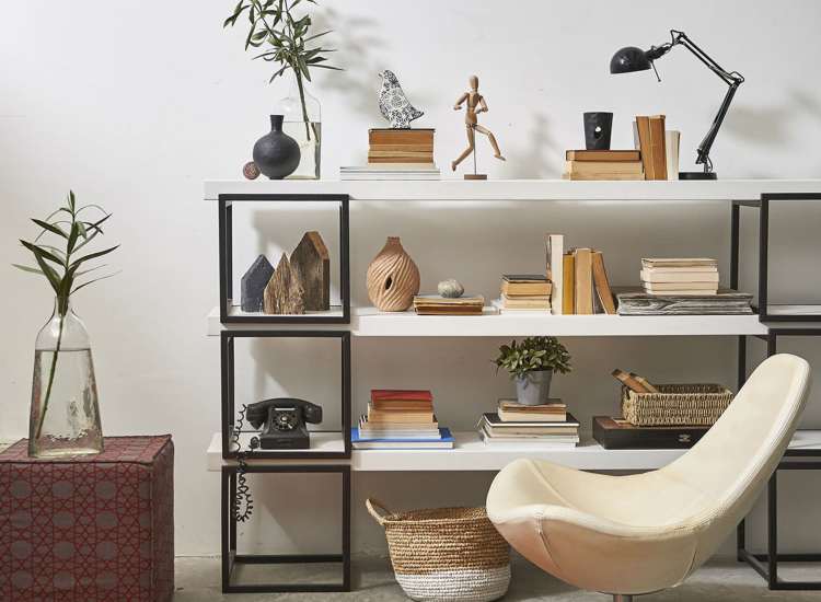 Aesthetic apartment room with a book shelve and a chair at Acushnet Commons in New Bedford,Massachusetts