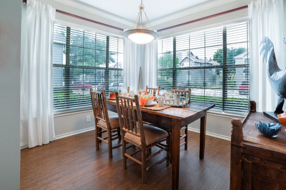 Dining room with wood style flooring at Marquis at Lantana in Flower Mound, Texas