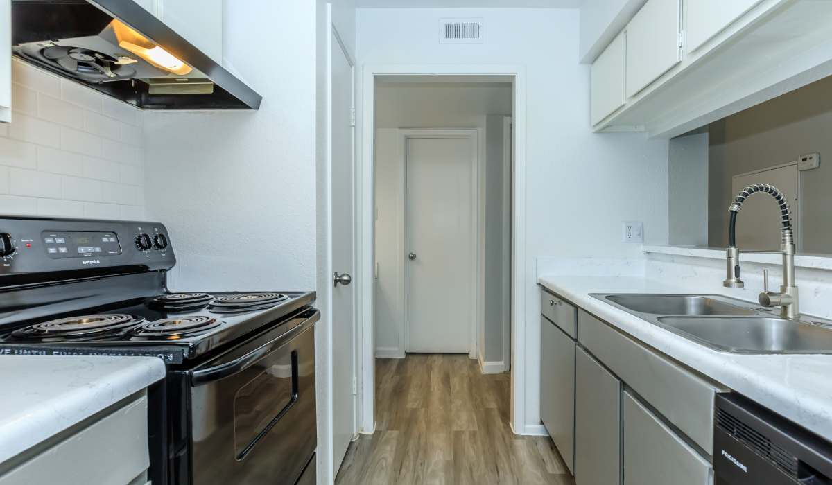 Kitchen with appliances at Costa Mesa Apartments in Houston, Texas