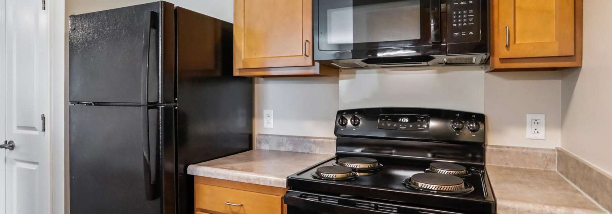 Kitchen with black appliances at Allegany Junction in Cumberland, Maryland