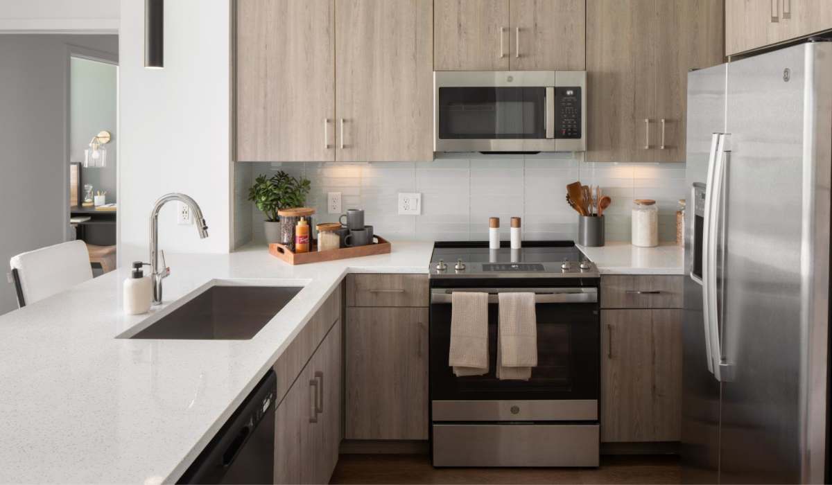 View of island kitchen from living room at Afton Palms in Sanford, Florida, 