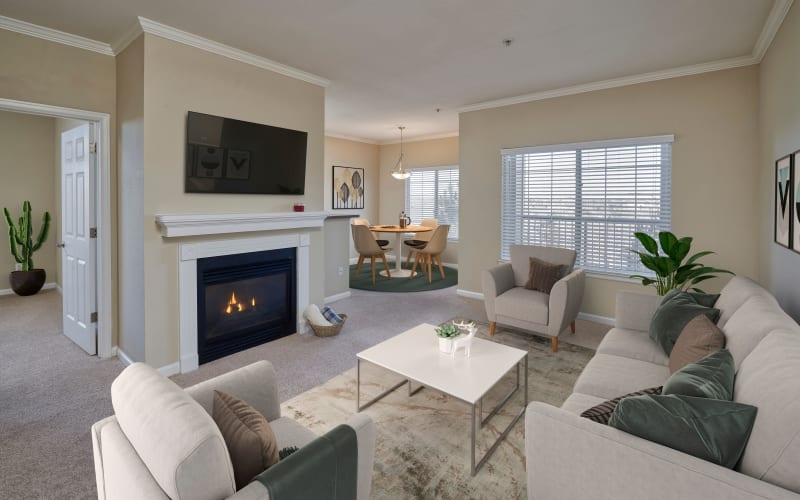 Decorated living room and dining room at Skyecrest Apartments in Lakewood, Colorado