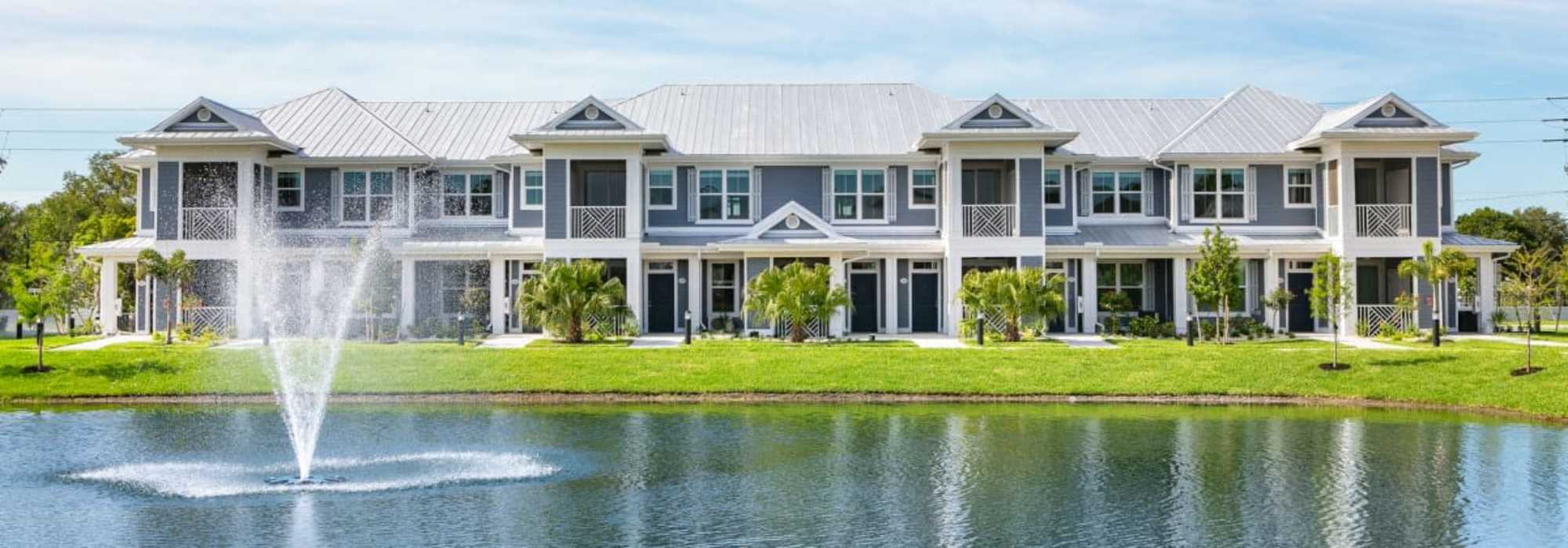 Apartment exterior with lake view at The Bergamot Apartments On 780 in Sarasota, Florida