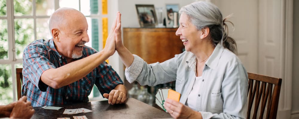 Two residents playing a card game together at Liberty Arms Assisted Living in Youngstown, Ohio