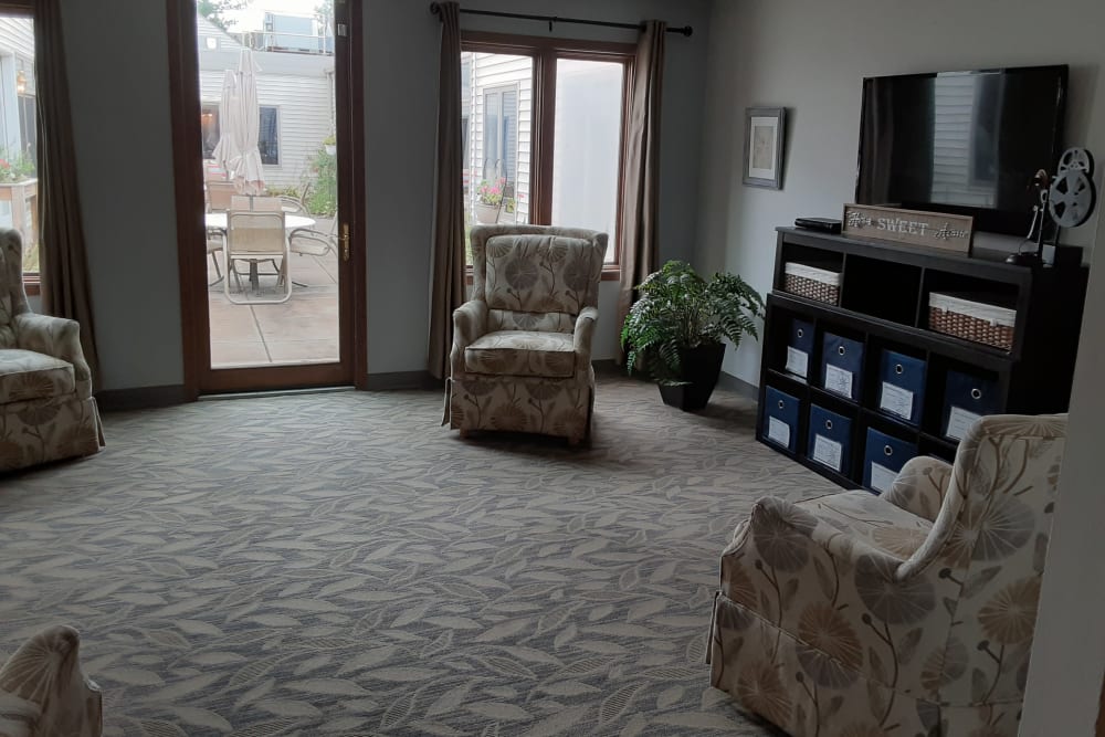 Spacious living area with patio access at The Atrium in Rockford, Illinois.