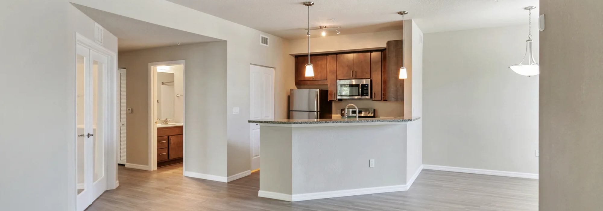 Modern kitchen with sleek cabinetry and open layout at Lemon Bay Apartments in Englewood, Florida.